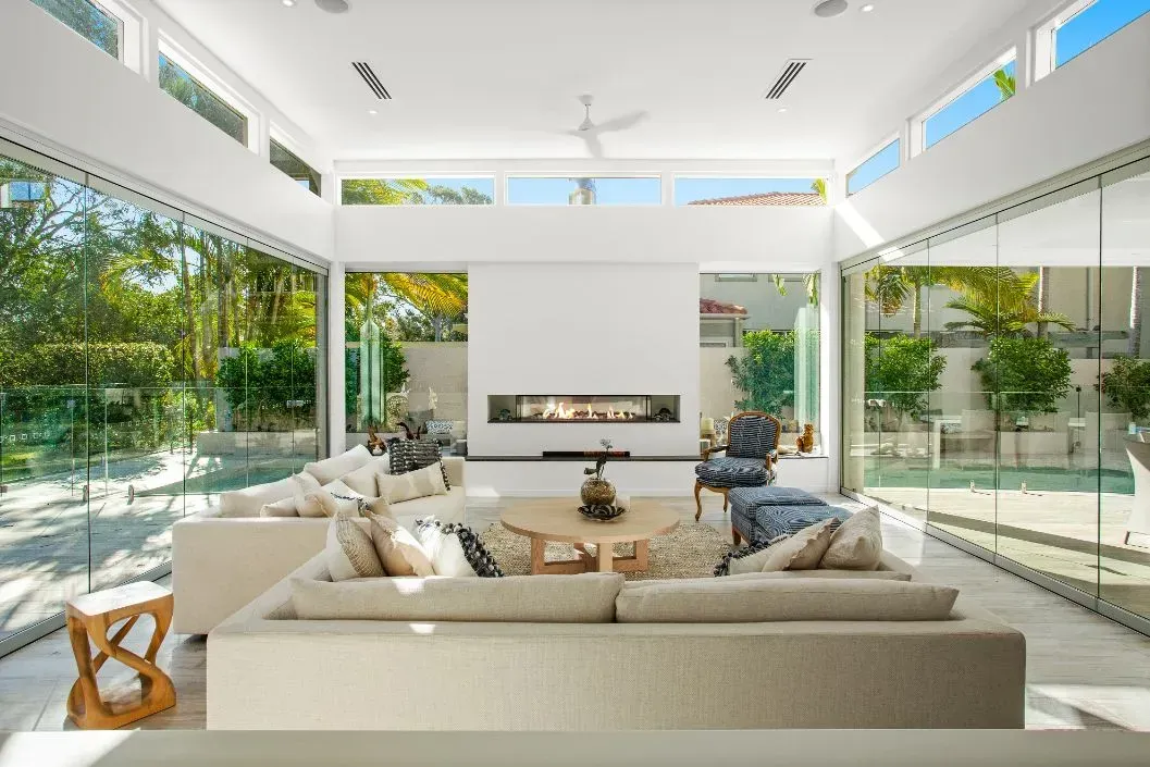 A Living Room With a Couch and Chairs and a Table — Paul Cooper Homes In Noosa Heads, QLD