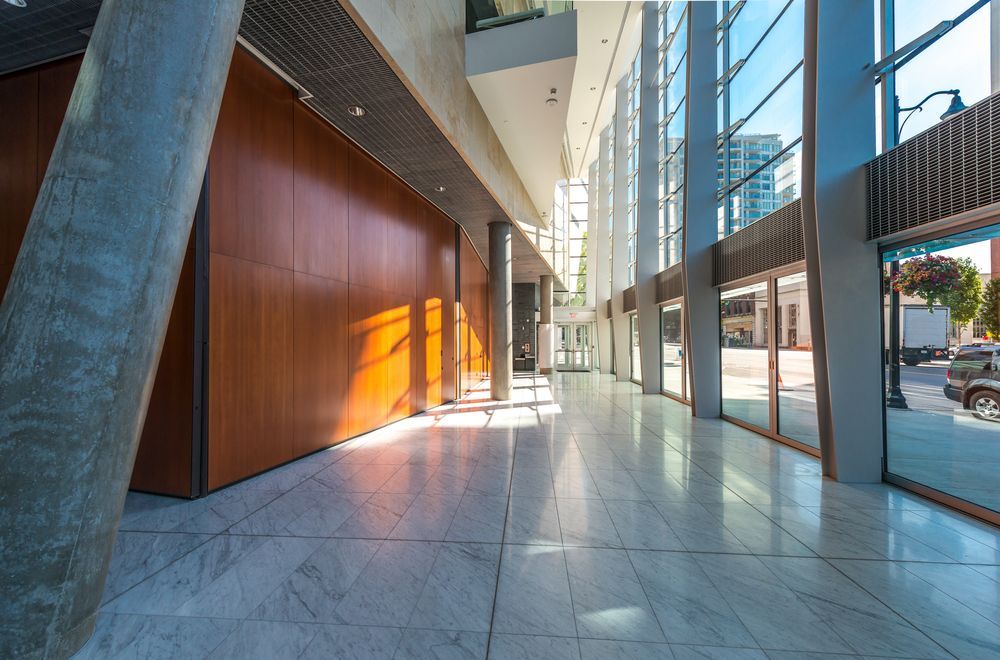 A Long Hallway in a Building With a Lot of Windows and a Wooden Wall — Paul Cooper Homes In Noosa Heads, QLD