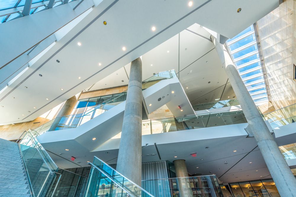 The Inside of a Large Building With Stairs and Columns — Paul Cooper Homes In Noosa Heads, QLD