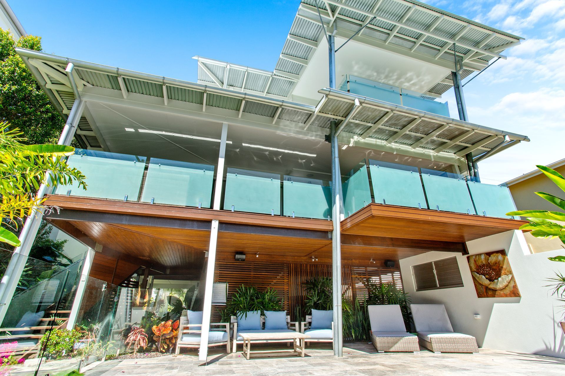 Looking Up at a Tall Building With a Lot of Windows — Paul Cooper Homes In Noosa Heads, QLD