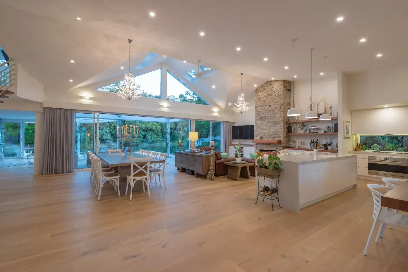 A Large Lobby of a Hotel With a Staircase and Columns — Paul Cooper Homes In Noosa Heads, QLD