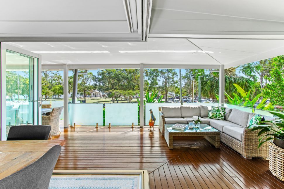 A Kitchen With a Stove Top Oven and a Sink — Paul Cooper Homes In Noosa Heads, QLD
