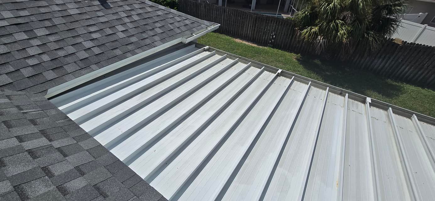 A close up of a roof with a gutter on it.