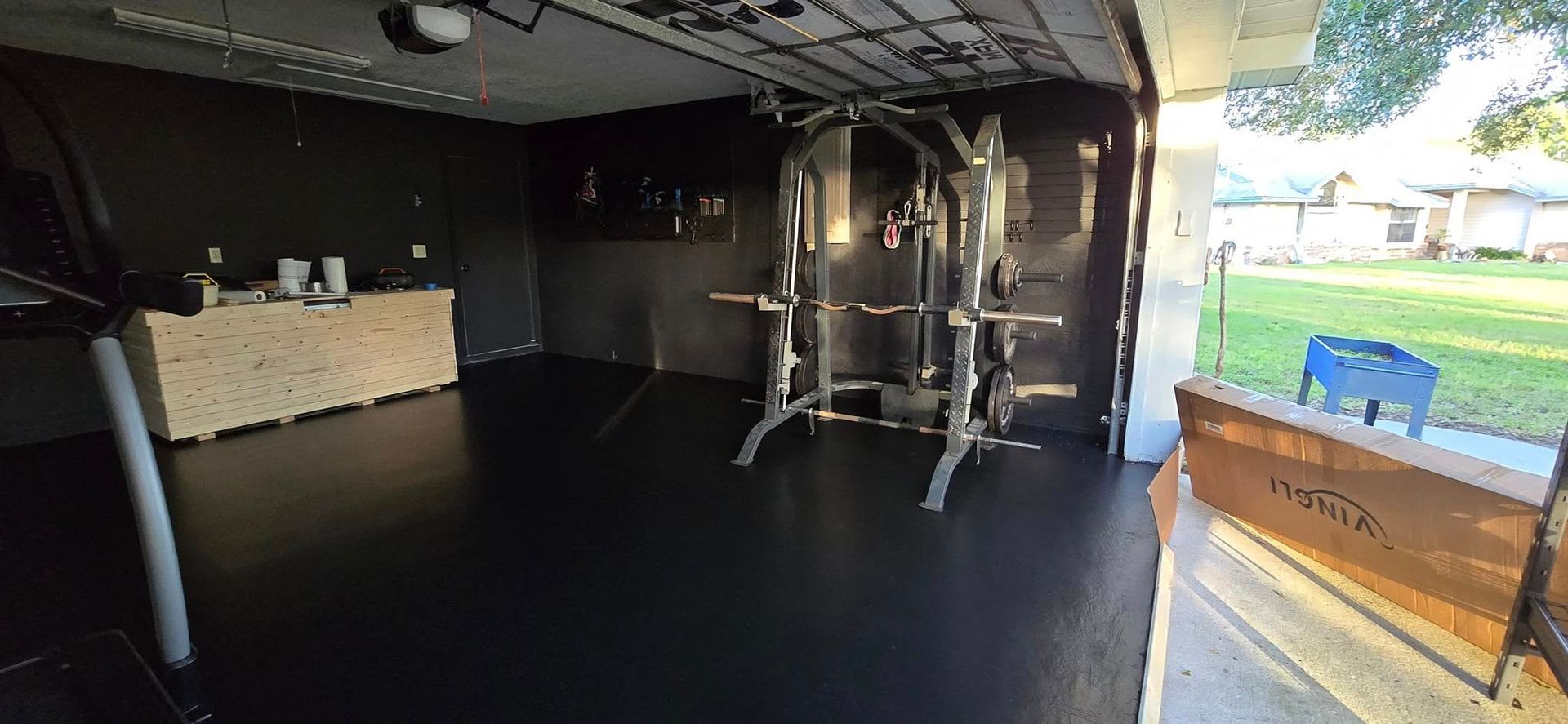 There is a gym in the backyard with a lot of equipment.