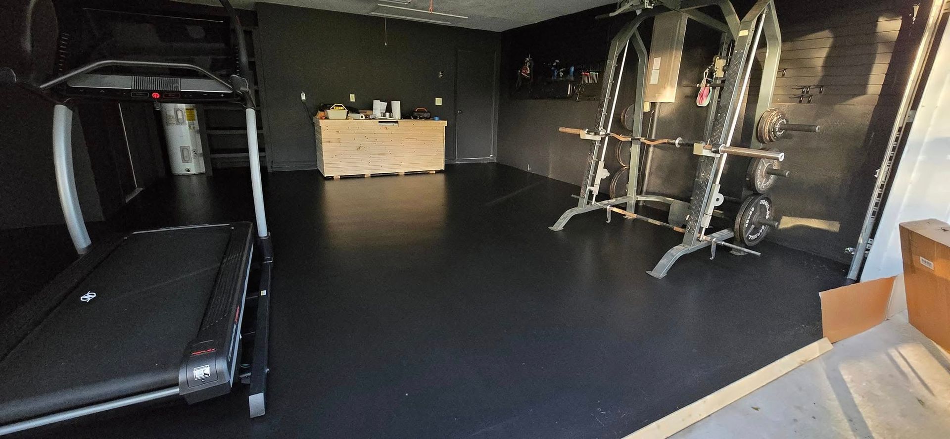 There is a treadmill in the middle of the room.