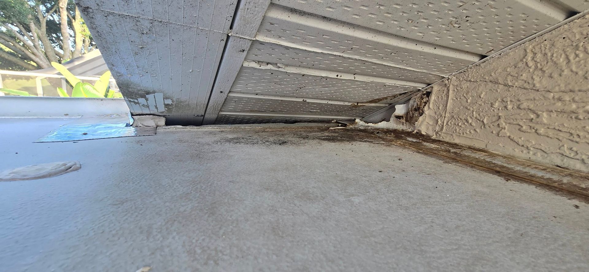 A close up of a concrete floor next to a building.