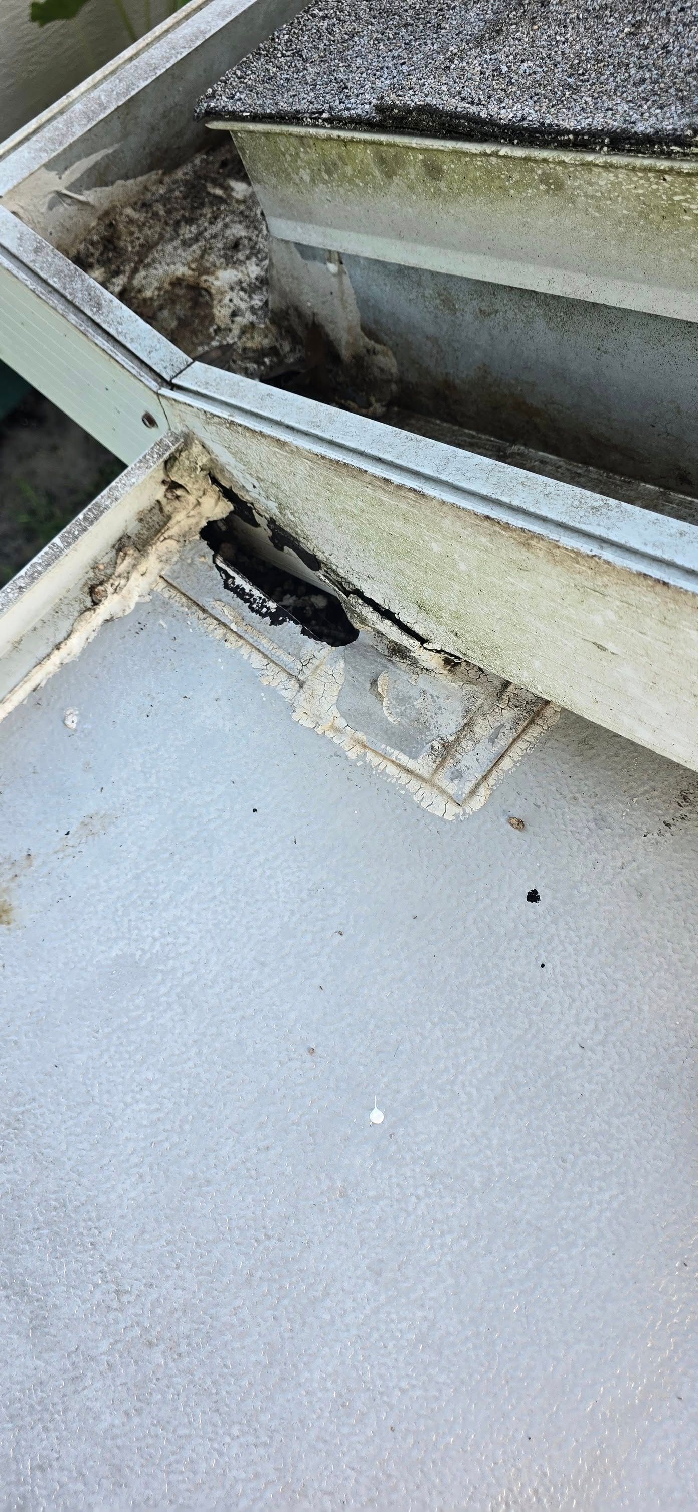 A close up of a roof with a hole in it.