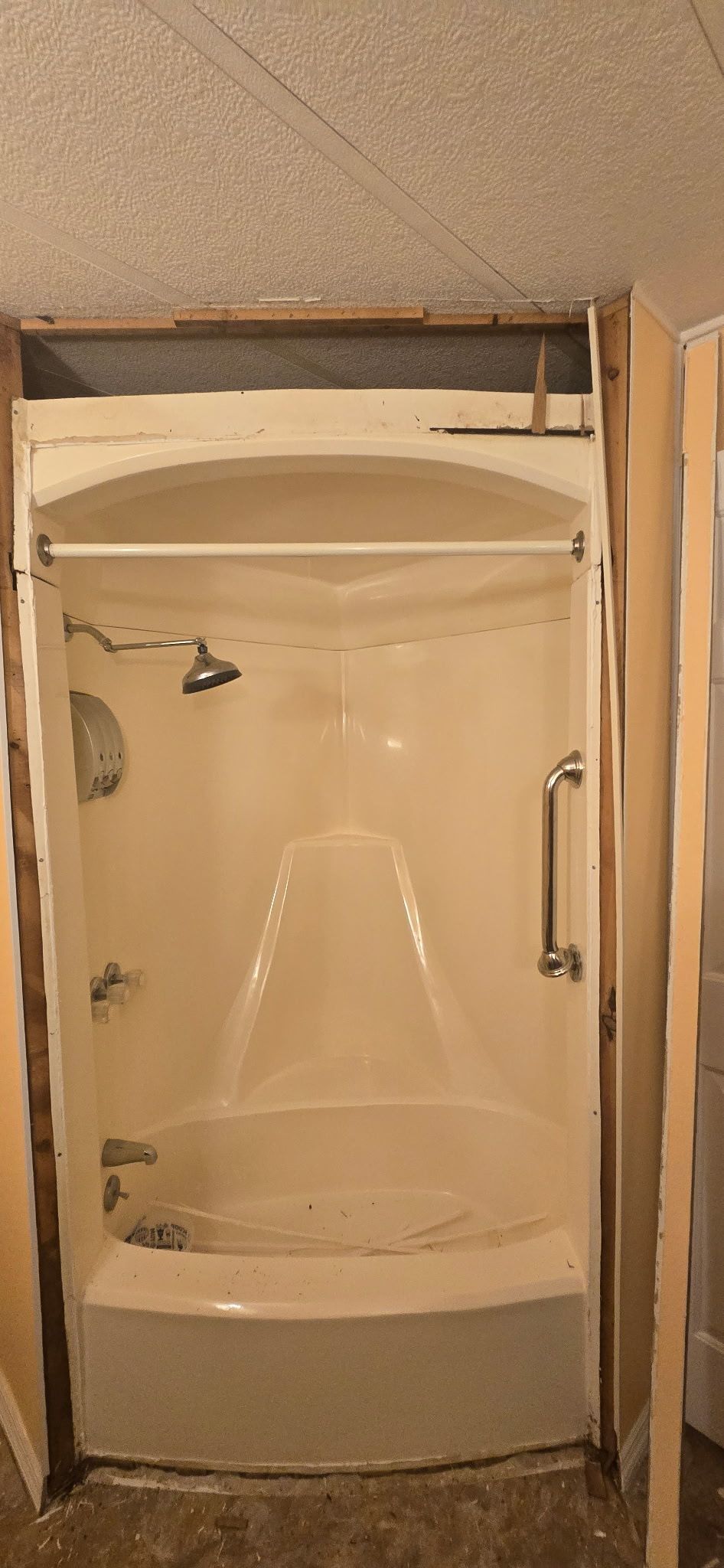 A bathroom with a bathtub and a shower stall.