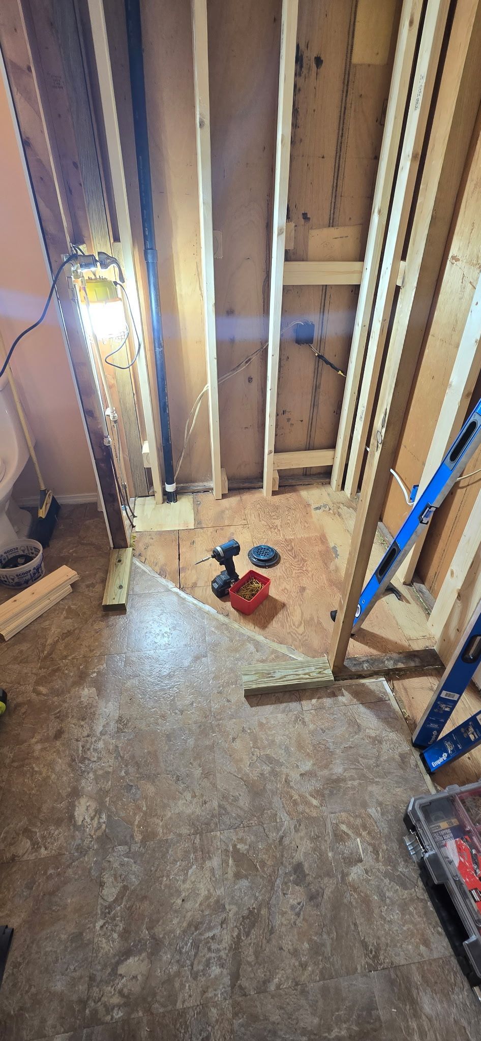 A room with a lot of wood and a ladder in it.