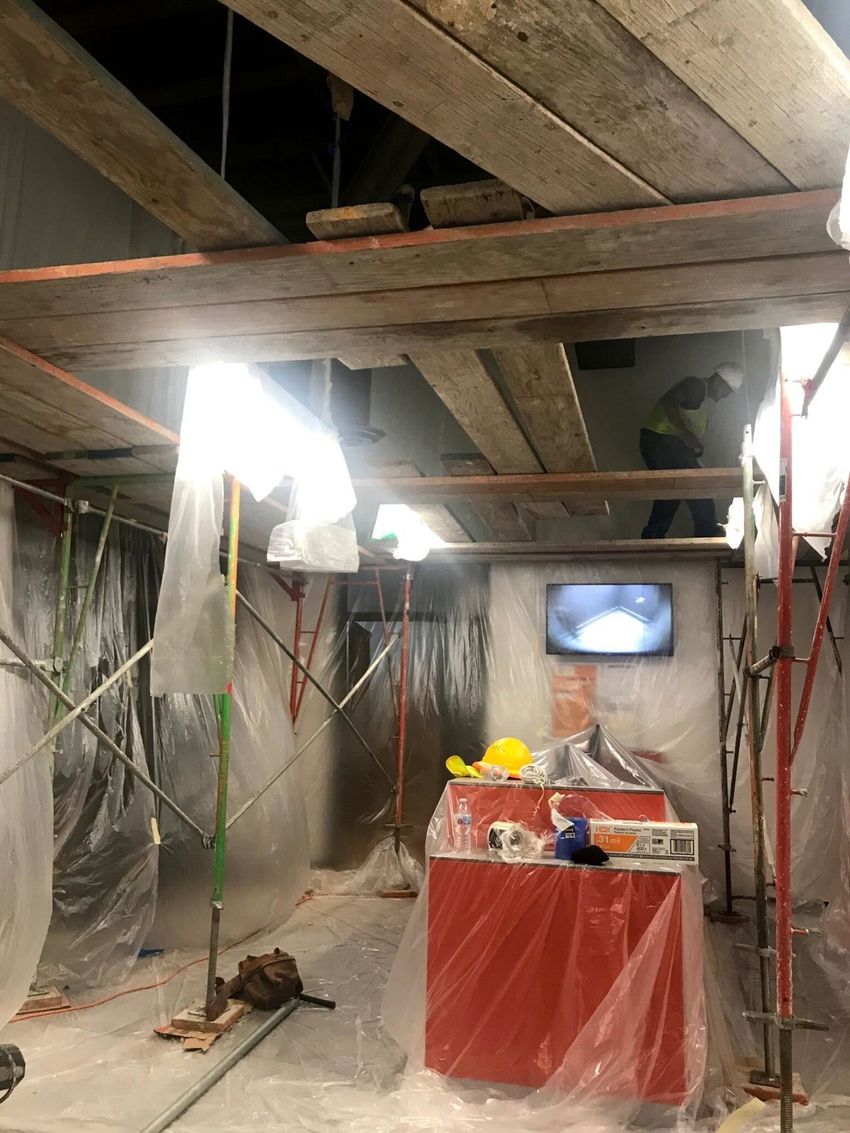 A house is being built with wooden beams and walls.