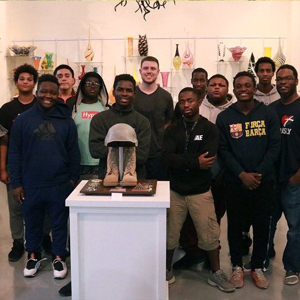 A group of teenagers in a room of artwork