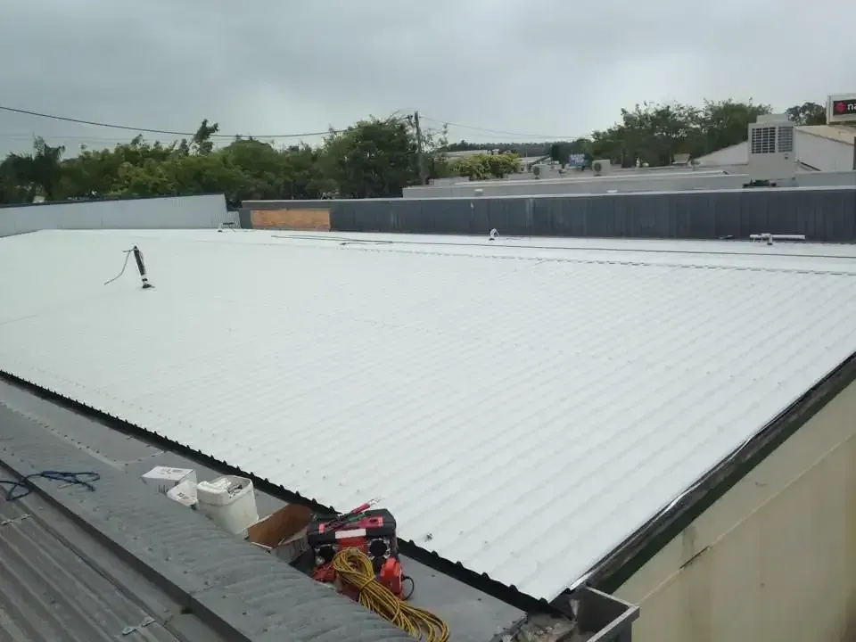 A Hose Is Coming Out Of A Drain In The Ground — LJG Plumbing In Sarina, QLD