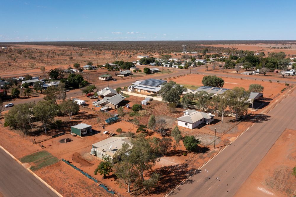 Aerial View of a Small Town in a Red-earth Desert — LJG Plumbing In Ooralea, QLD
