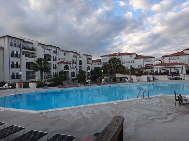 A large swimming pool in front of a building