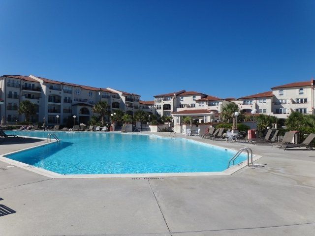 A large swimming pool in front of a building