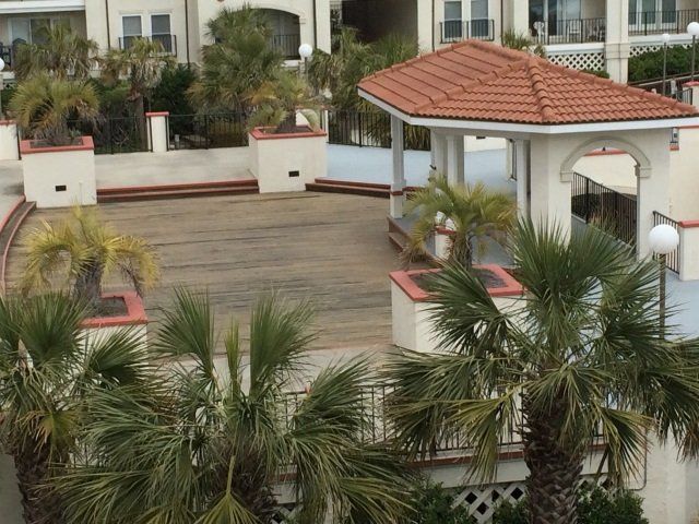 An aerial view of a gazebo surrounded by palm trees