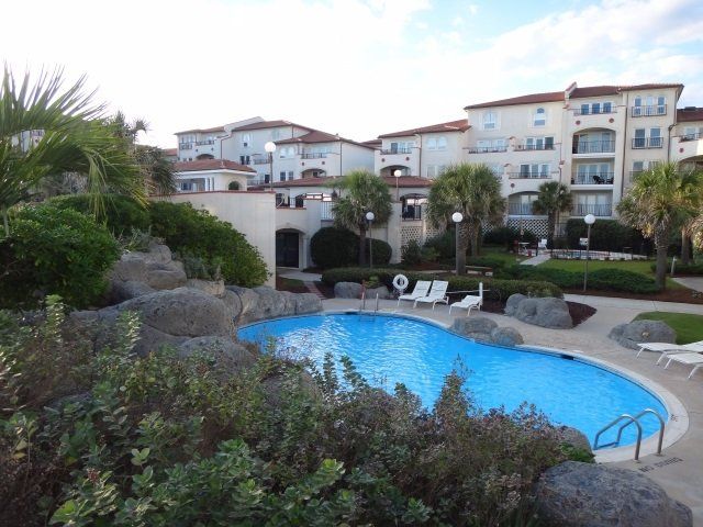 A large swimming pool in front of a building