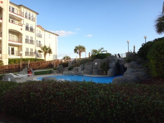 A large swimming pool in front of a building