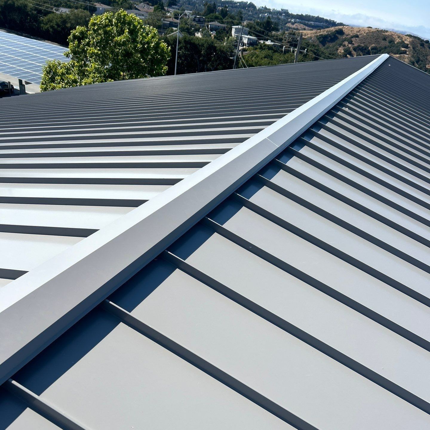 A white gutter on the side of a house