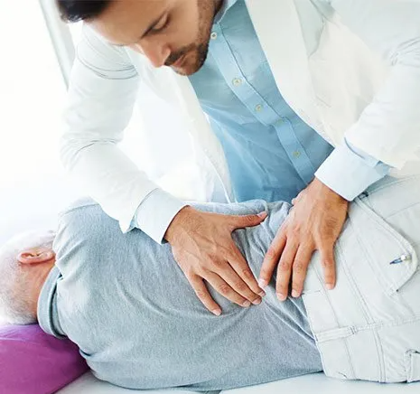 Chiropractor Fixing Elder Man's Spine — Winchester, KY  — Miller  Chiropractic Centre Inc PSC