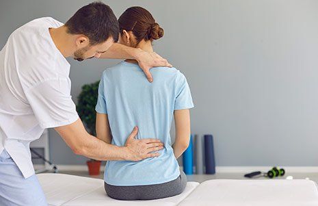 Woman Getting Her Spine Adjusted — Winchester, KY  — Miller  Chiropractic Centre Inc PSC
