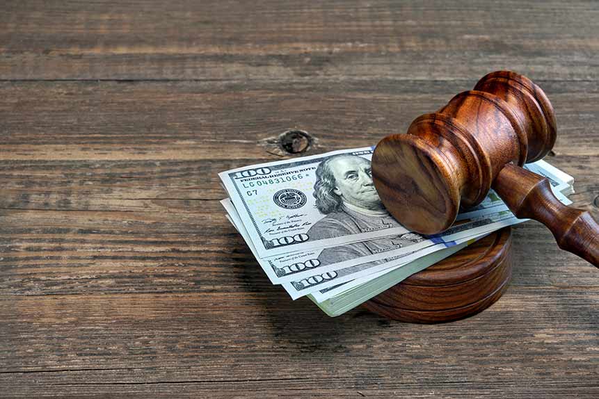 Judges gavel and money on the wooden table — San Antonio, TX — A-Action Bail Bonds