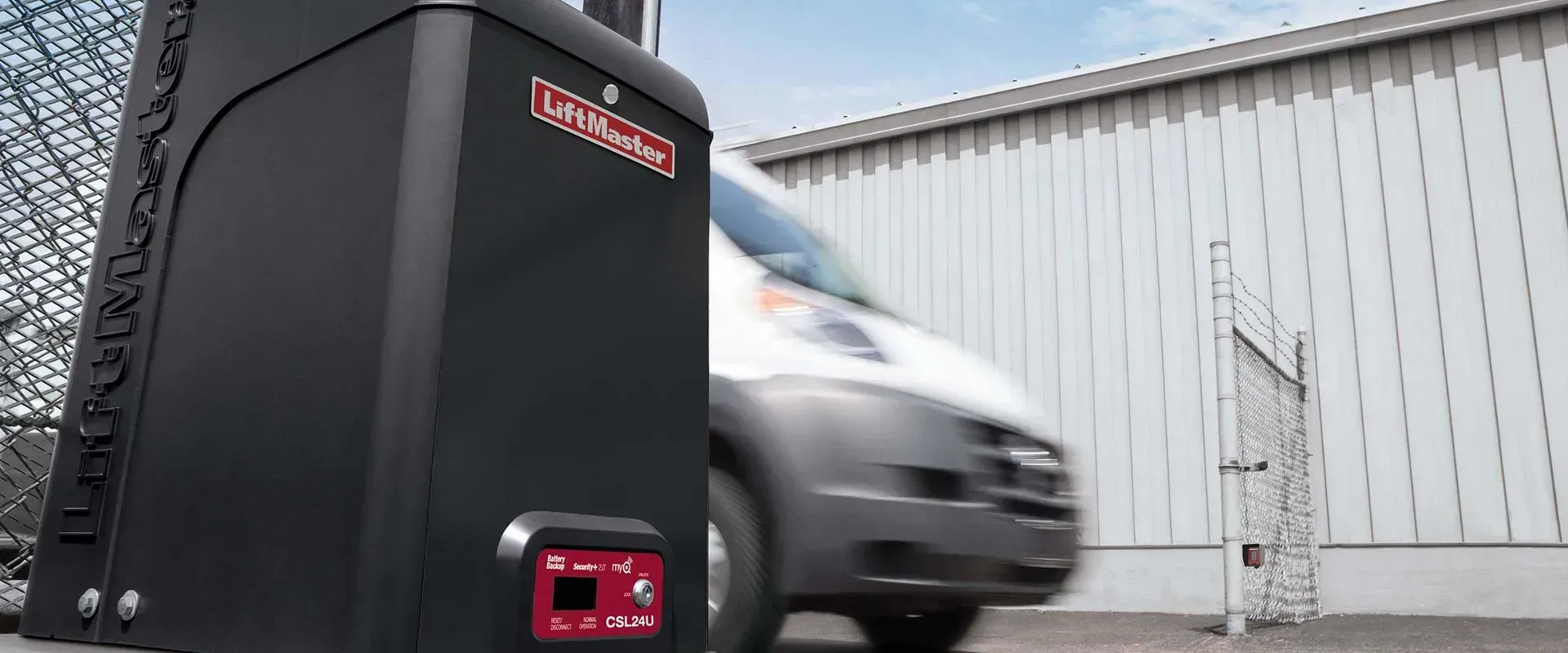 a van beside the  electric gate controler with the logo of Liftmonster