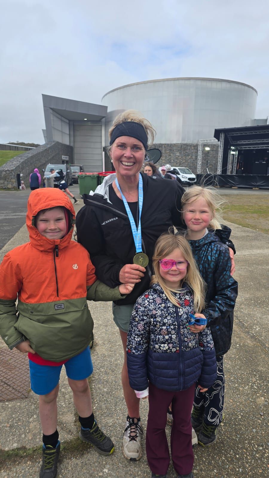 Woman running and finishing an ultra marathon in the mountains, endurance and strength in nature