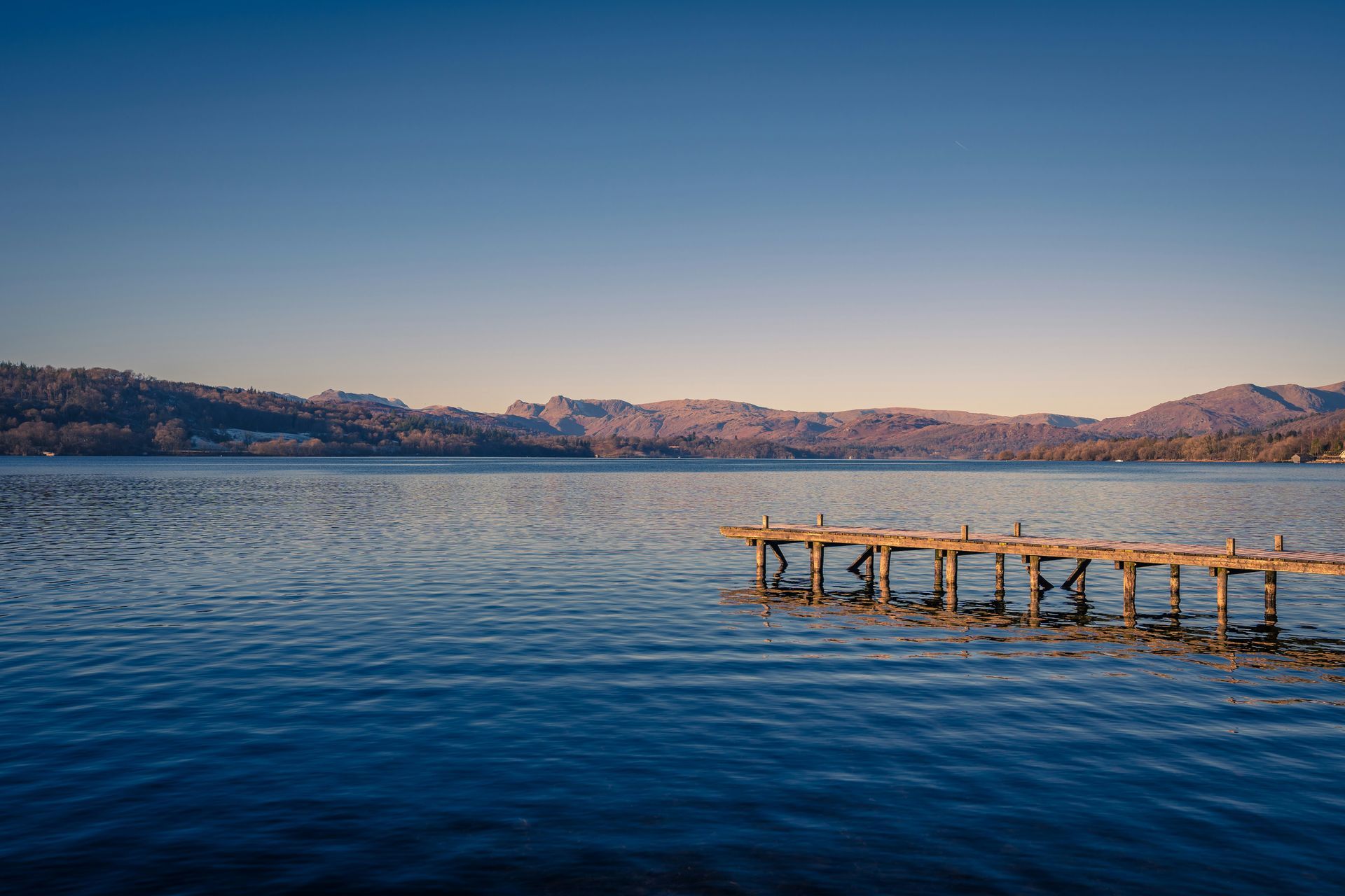Jetty in snow in lake district