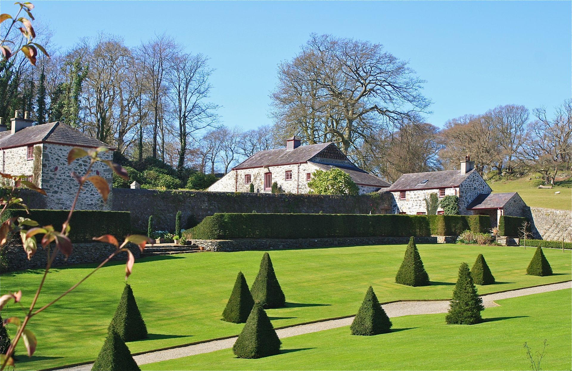 a beautiful house with lawn and trees