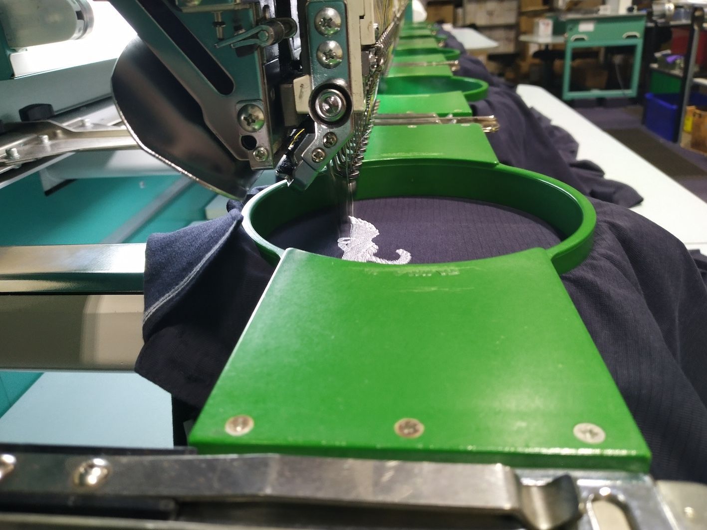A Close Up Of A Machine Embroidery On A Black Shirt — Coastal Monogramming In Maroochydore, QLD