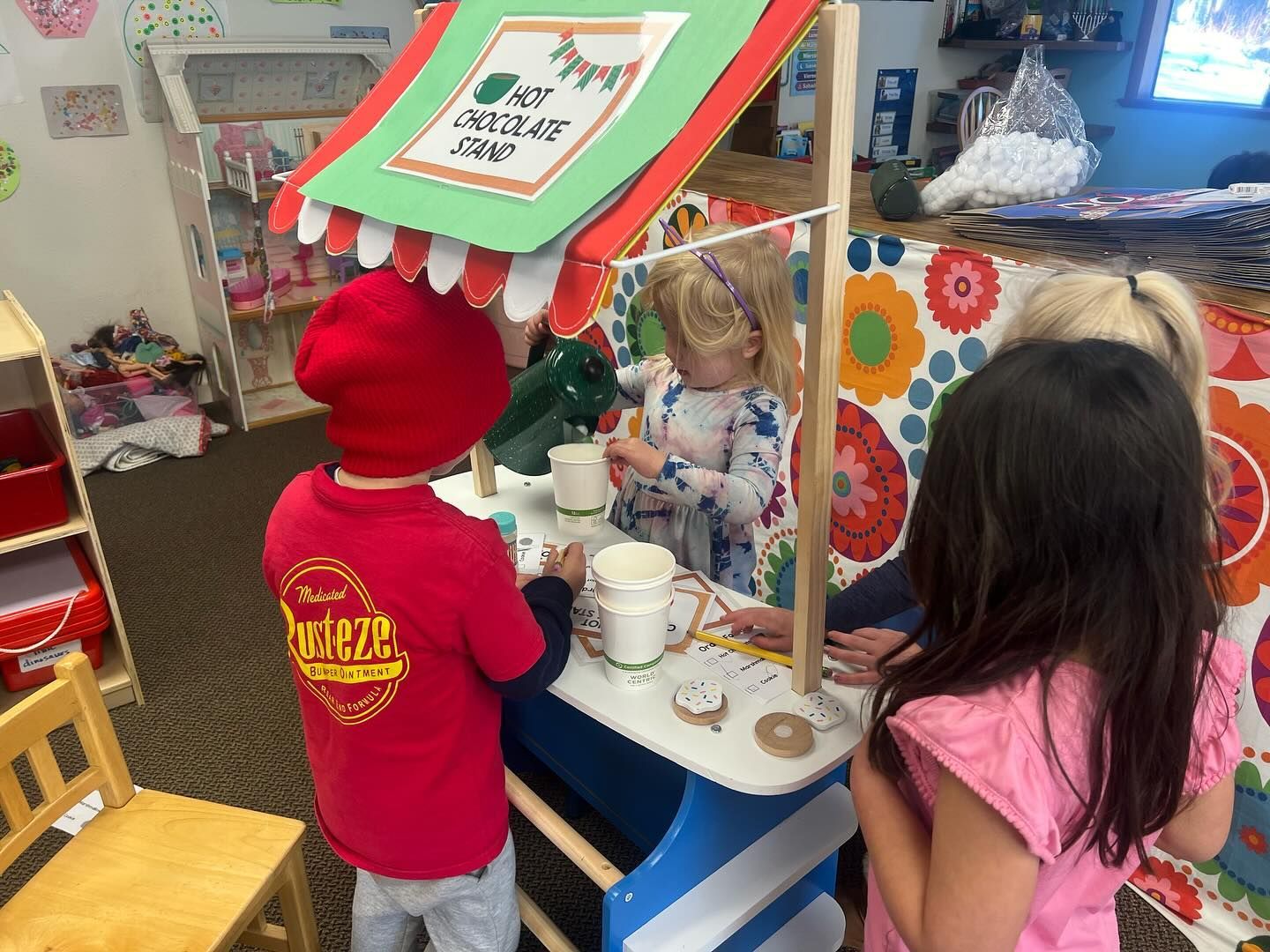 A group of children are playing in a playhouse.