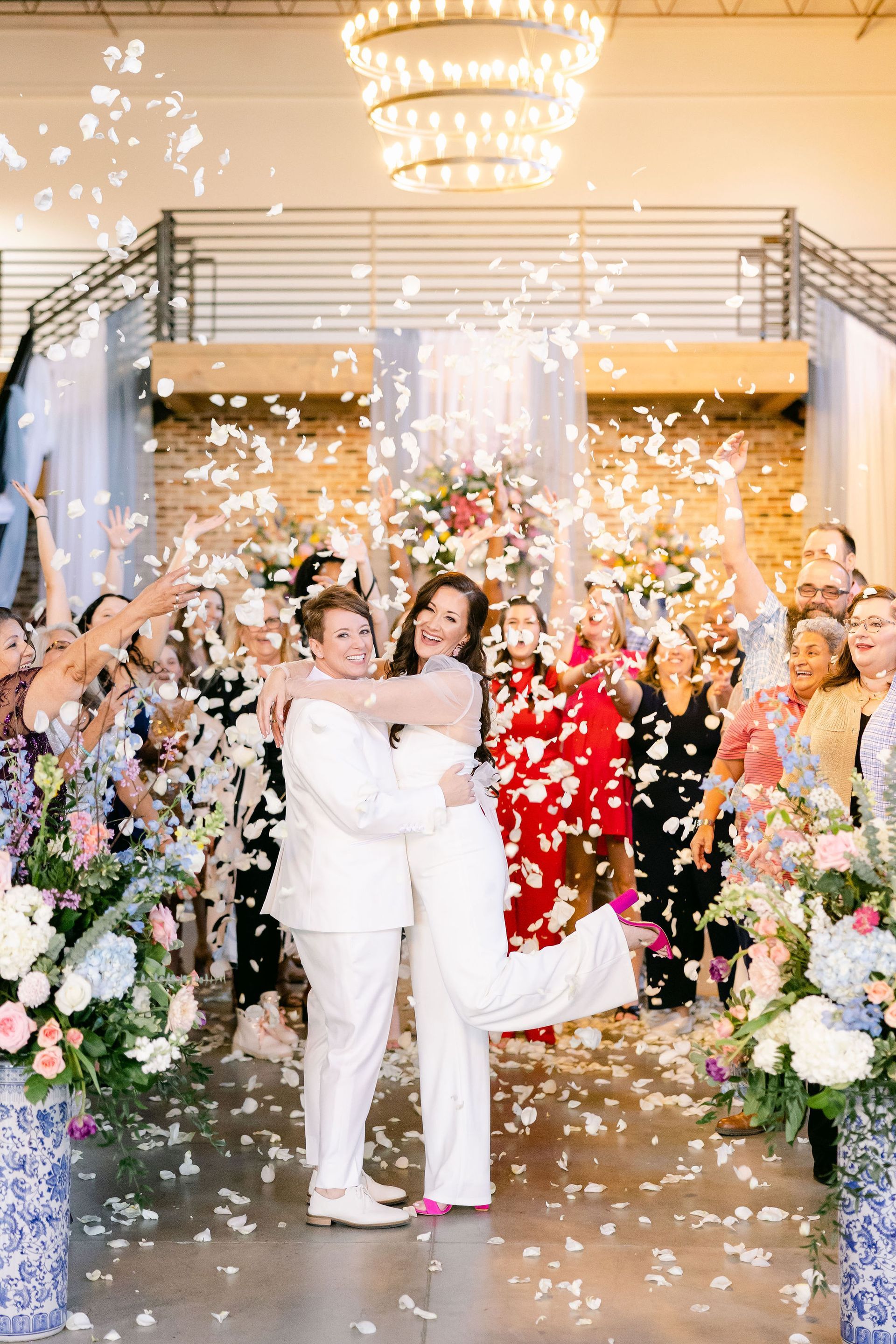 brides kissing during grand exit