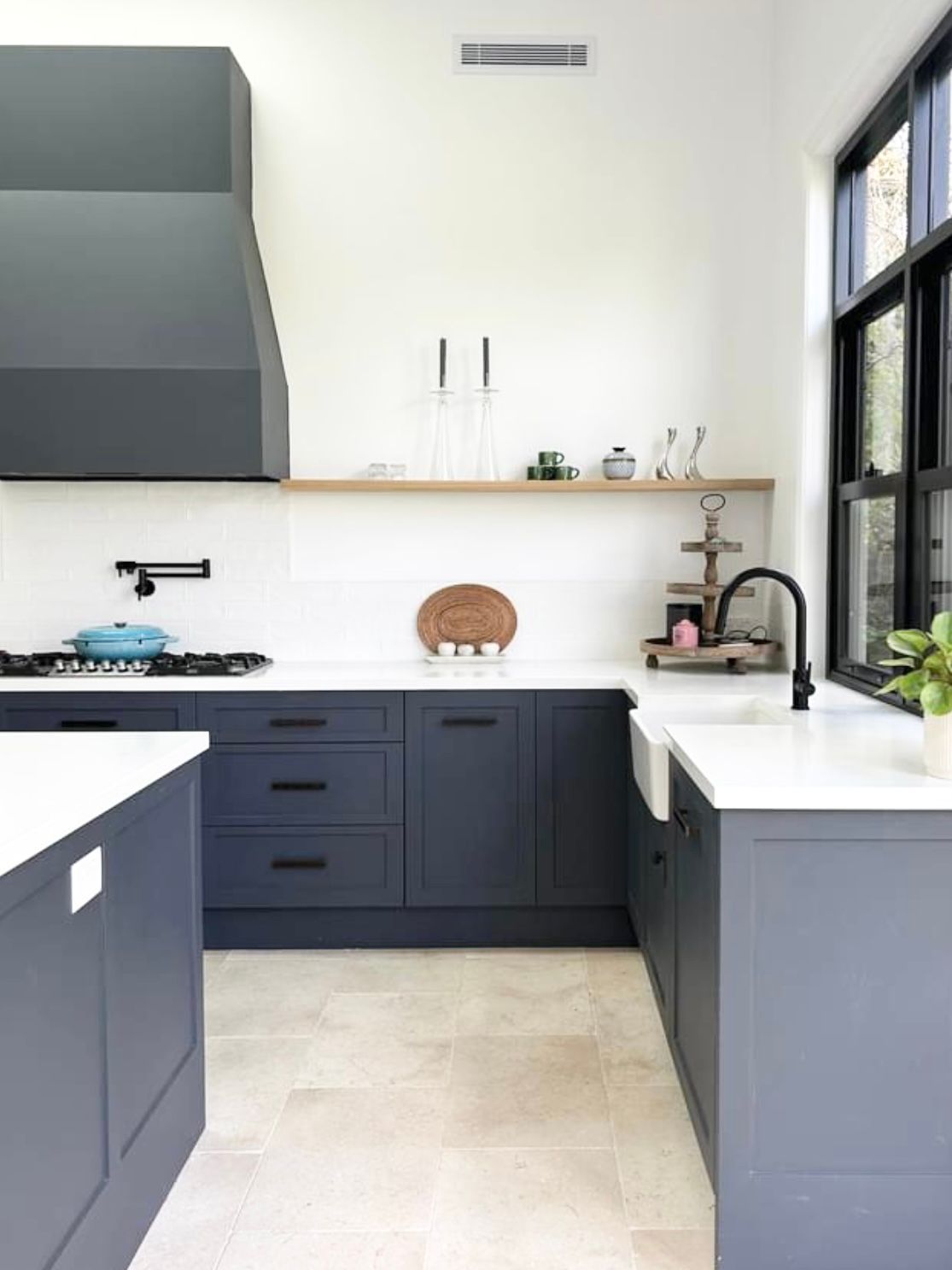 A Kitchen With Blue Cabinets, White Counter Tops, a Sink and a Stove — Kenross Kitchens In Erina, NSW