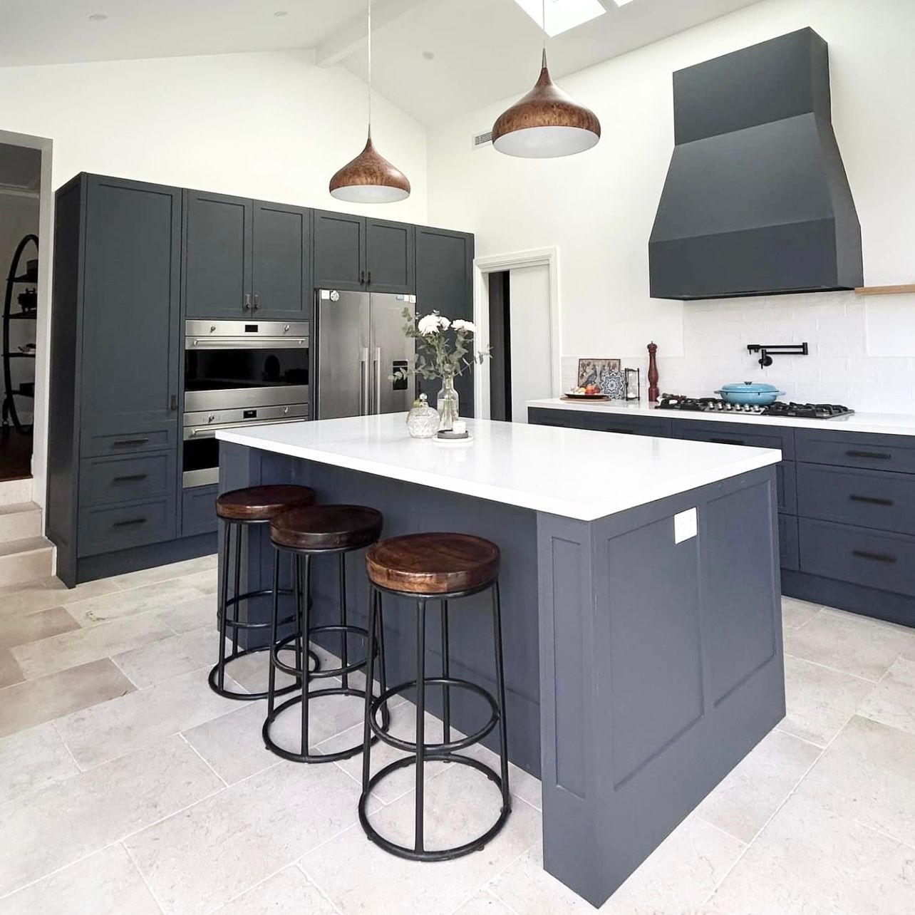 A Kitchen With a Large Island , Stools , a Refrigerator and a Sink — Kenross Kitchens In Erina, NSW
