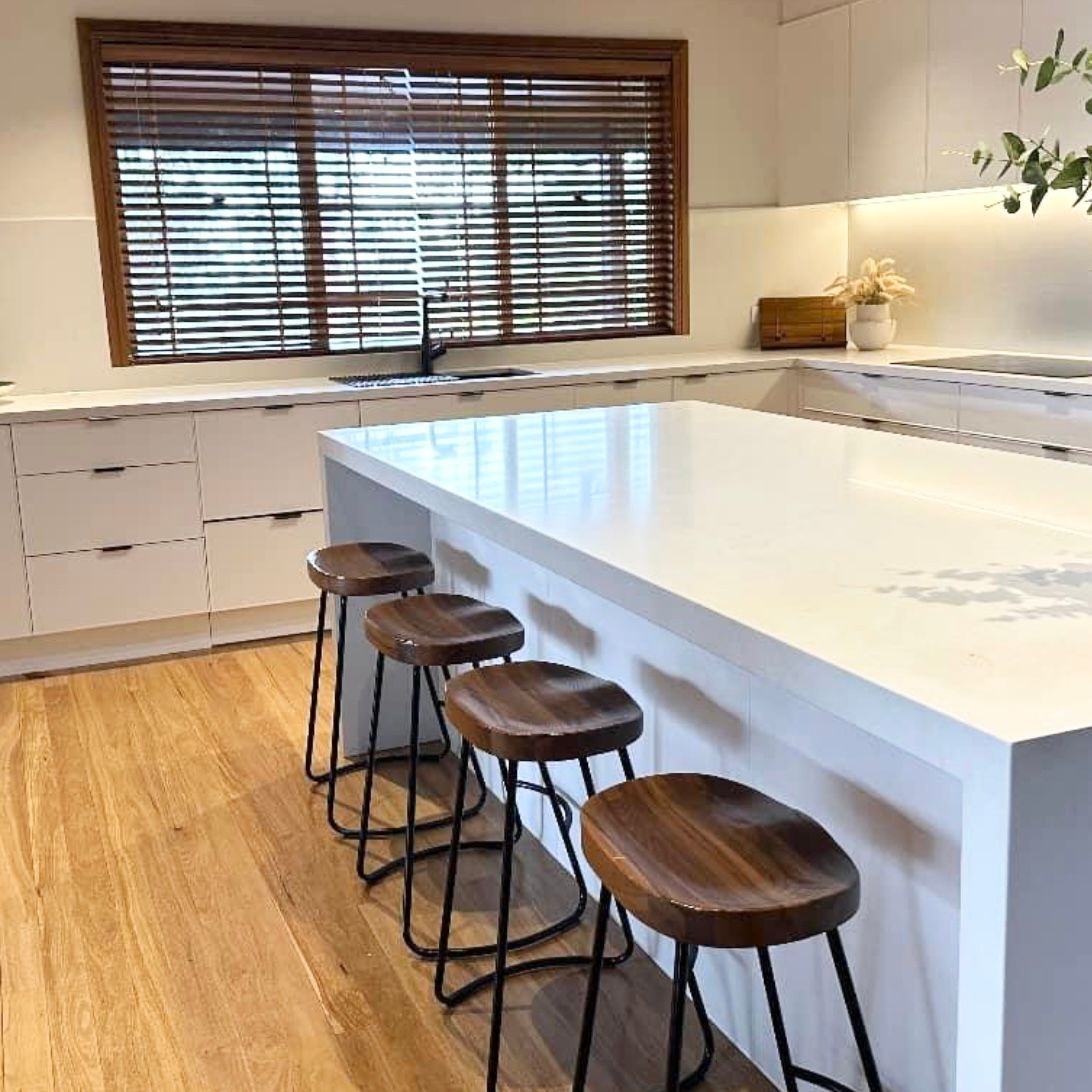 A Kitchen With Black Cabinets and a White Counter Top — Kenross Kitchens In Erina, NSW