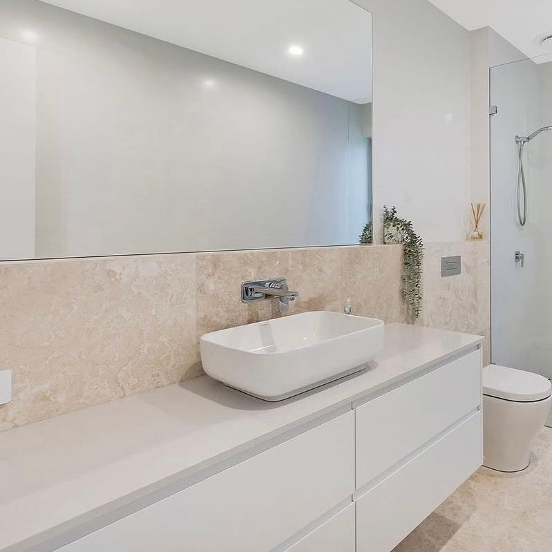 A Bathroom With Two Sinks and a Bathtub — Kenross Kitchens In Erina, NSW