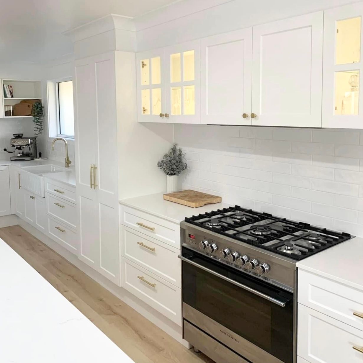 A kitchen with a sink and a bowl of lemons on the counter — Kenross Kitchens In Erina, NSW