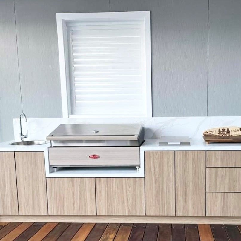 A white stone Kitchen Benchtop — Kenross Kitchens In Erina, NSW