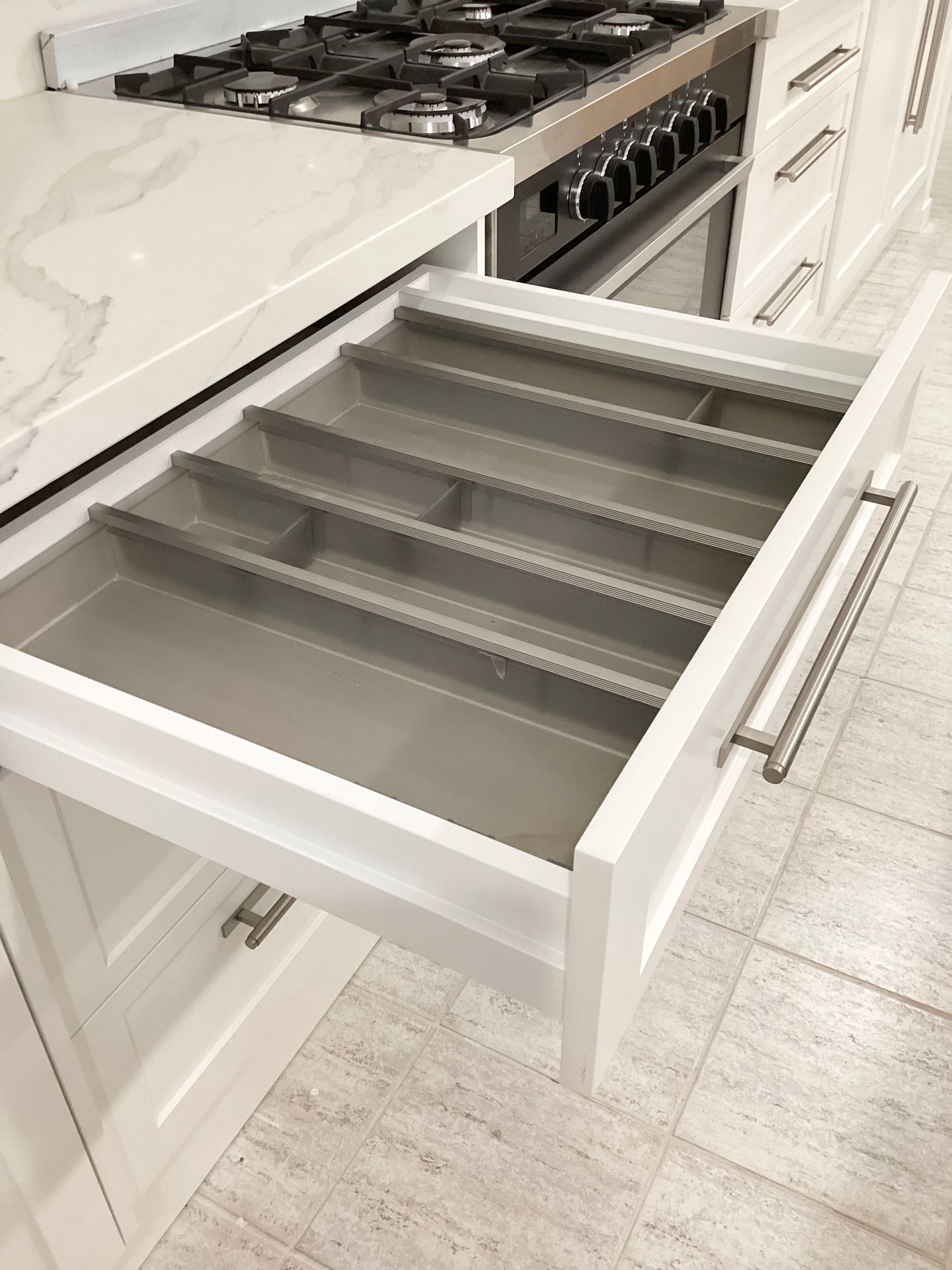 A walk in closet with lots of wooden shelves and drawers — Kenross Kitchens In Erina, NSW