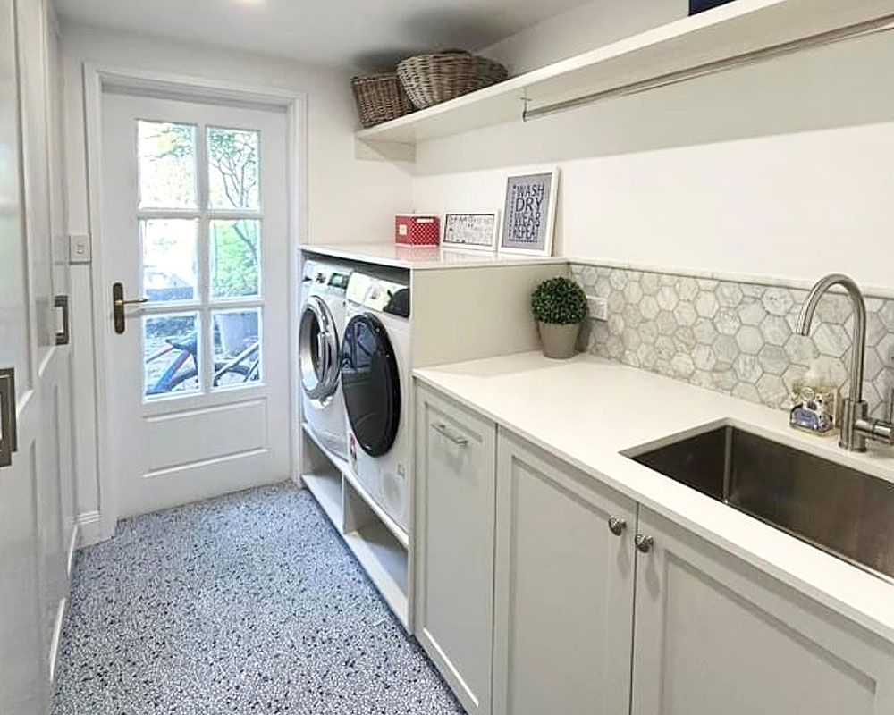 A Laundry Room With a Washer and Dryer and a Sink — Kenross Kitchens In Terrigal, NSW