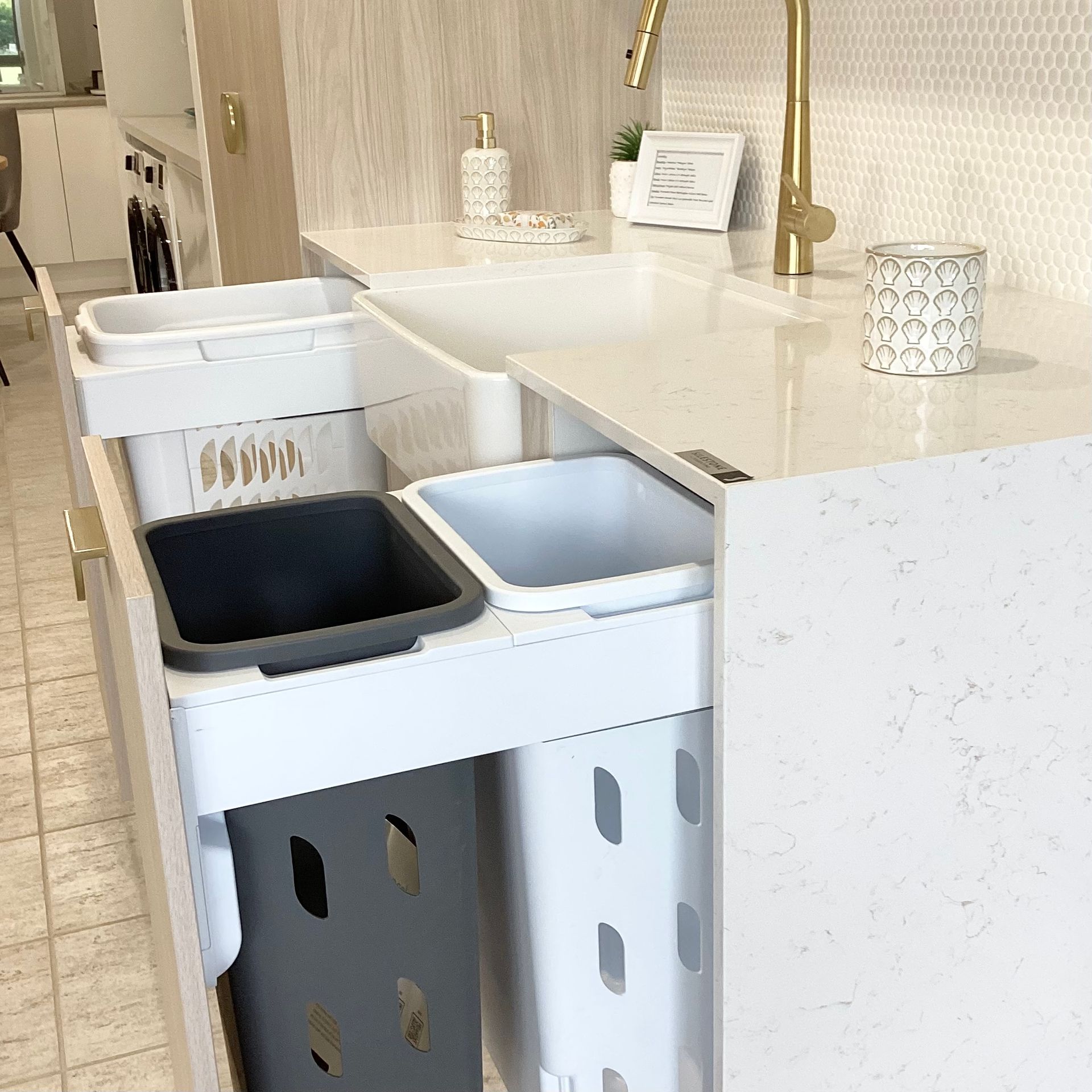 A Laundry Room With a Sink Washer and Dryer — Kenross Kitchens In Erina, NSW