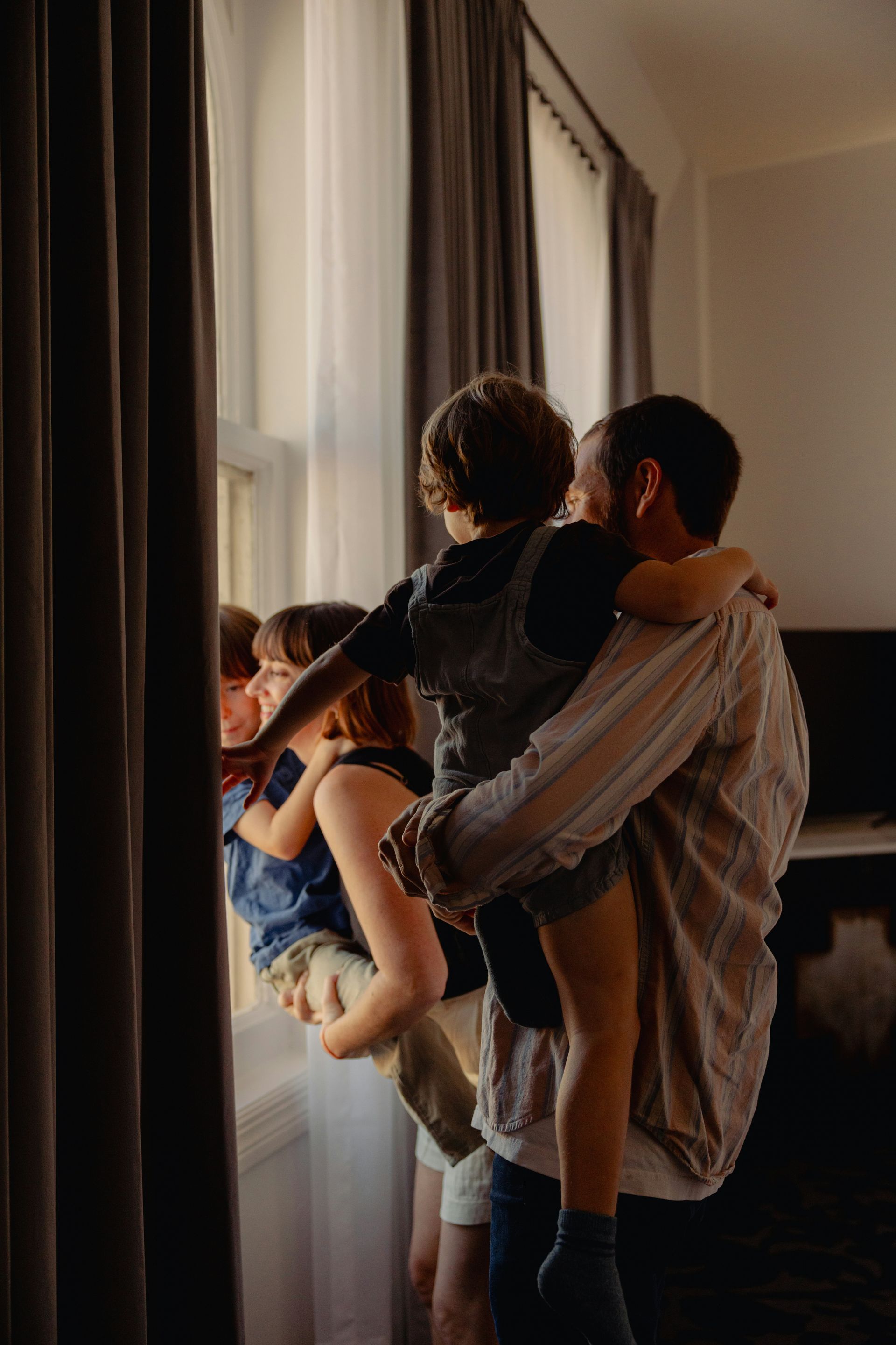 People signing documents at a table with a gavel, possibly in a legal setting.