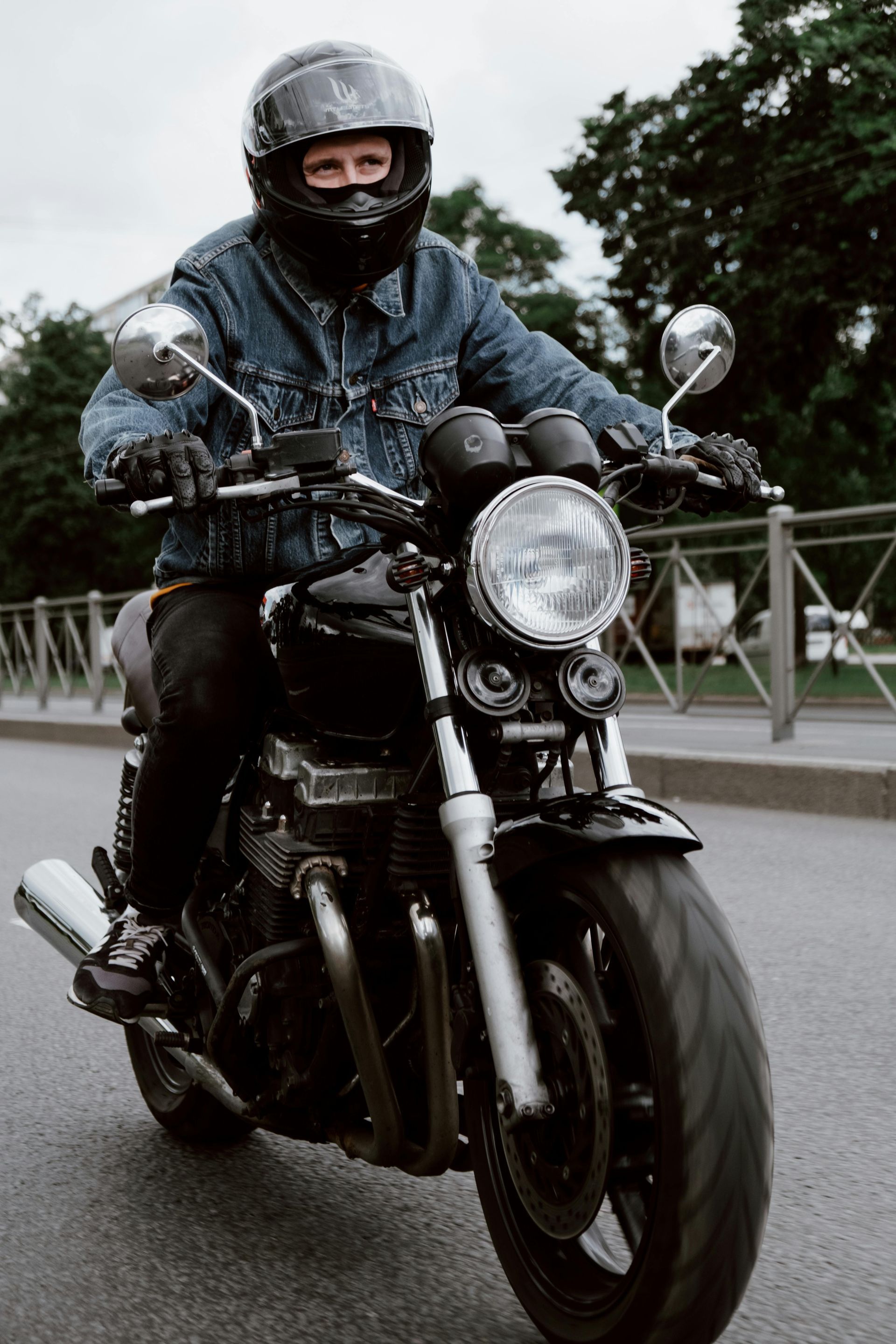 People signing documents at a table with a gavel, possibly in a legal setting.