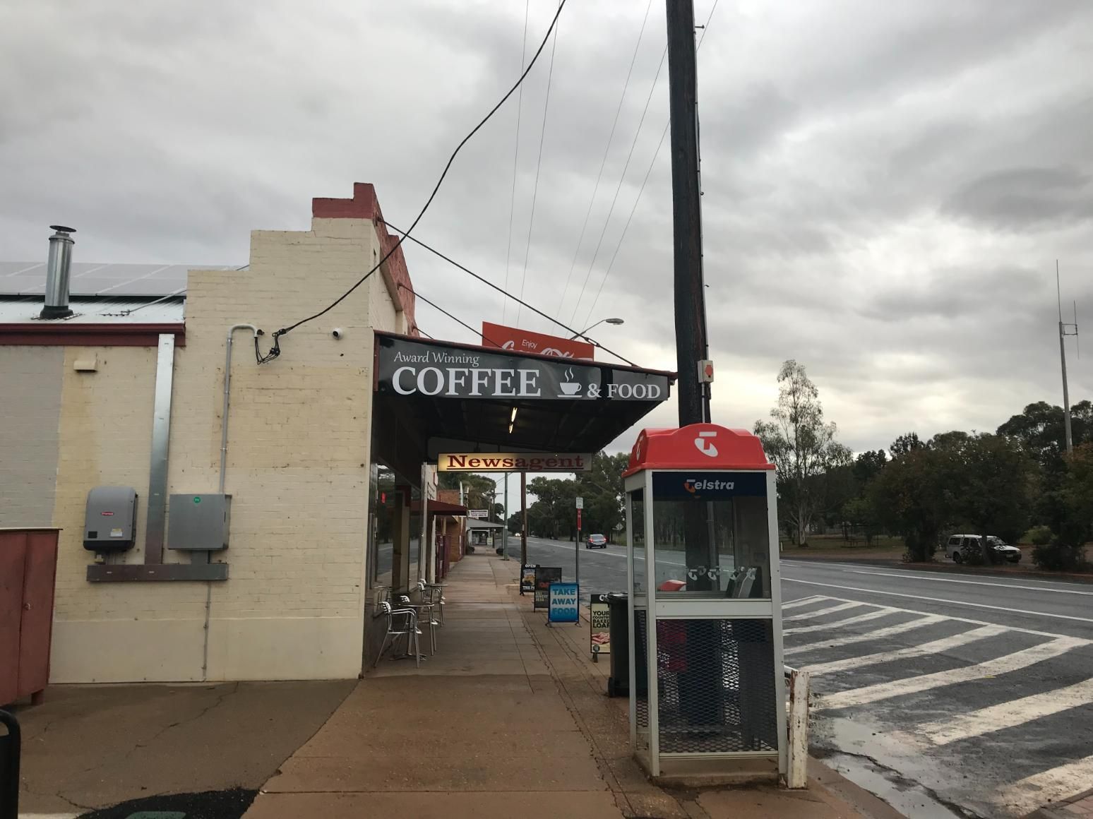 A Coffee Shop With A Red Phone Booth In Front Of It — Geurie General Store In Geurie, NSW