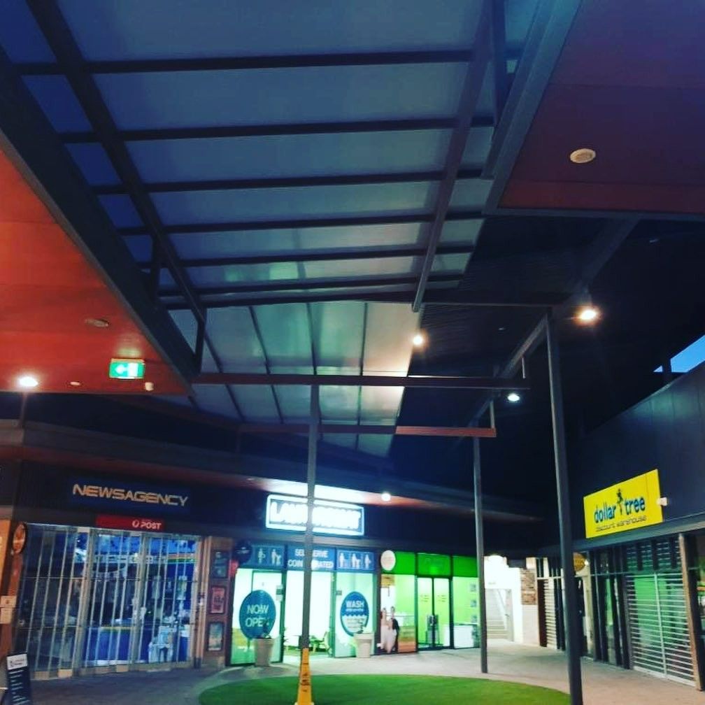 A Building With a Yellow Sign That Says Solar Tree — Barry Smith Engineering Pty Ltd in Coffs Harbour, NSW