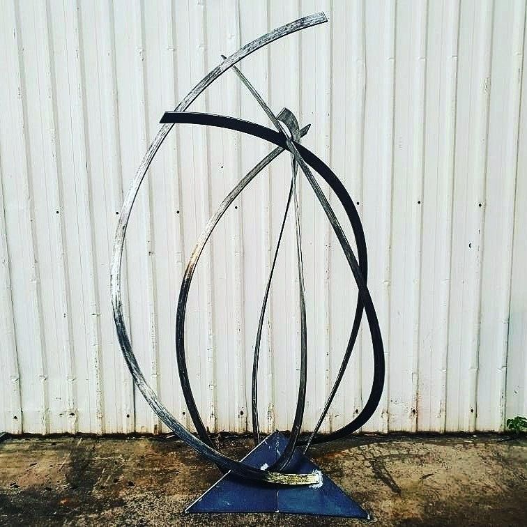 A Large Metal Sculpture is Sitting in Front of a White Wall — Barry Smith Engineering Pty Ltd in Coffs Harbour, NSW