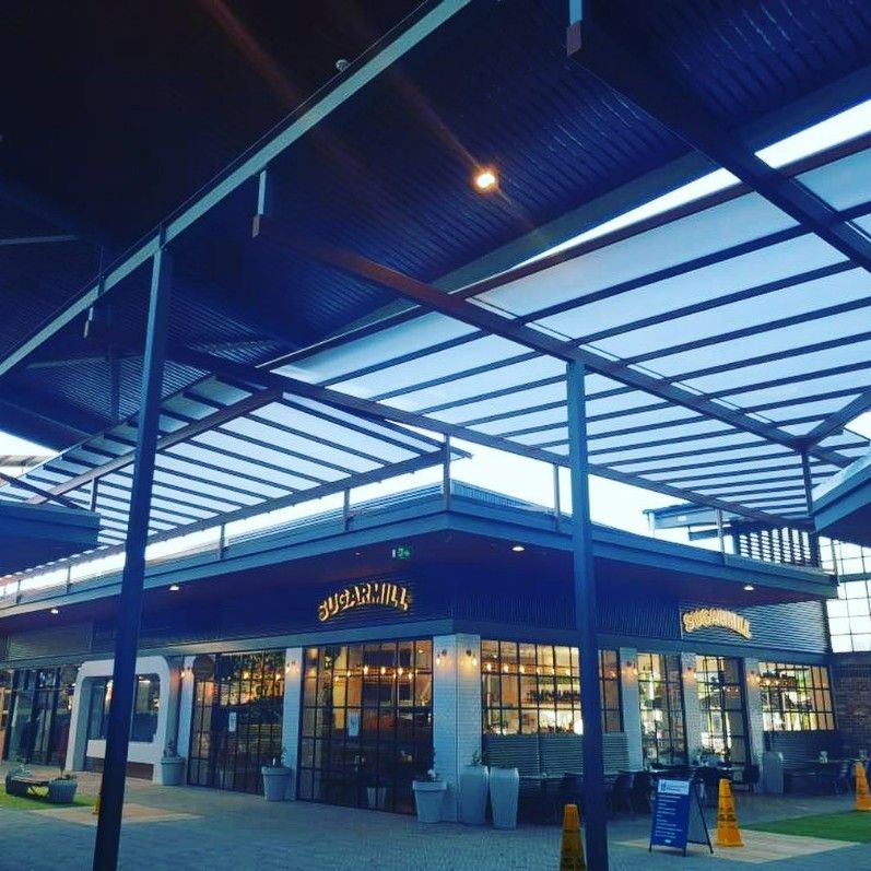 A Building With a Blue Roof and a Sign — Barry Smith Engineering Pty Ltd in Coffs Harbour, NSW