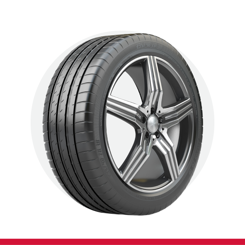 A close up of a tire on a wheel on a white background.