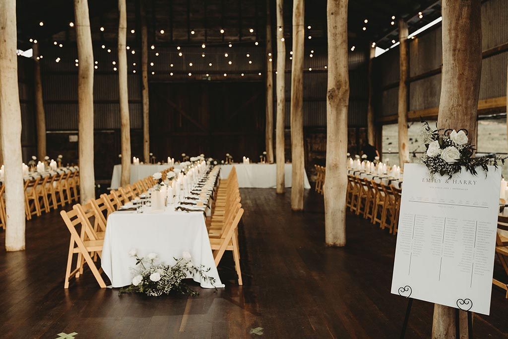 A large room with a long table and chairs in it.